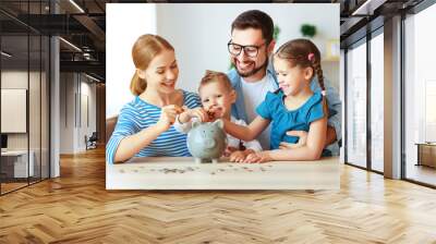 financial planning   family mother father and children with piggy Bank at home. Wall mural