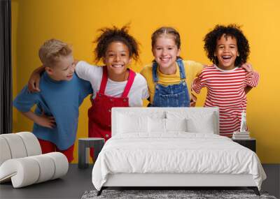 Group of cheerful happy multinational children on  yellow background Wall mural