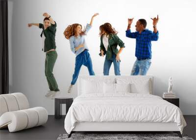 group of cheerful young people men and women isolated on white background. Wall mural