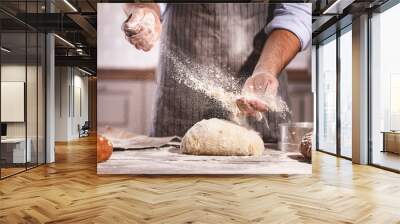 hands of baker's male knead dough Wall mural