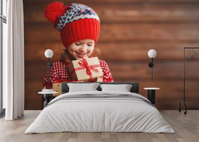 happy child girl with Christmas present Wall mural