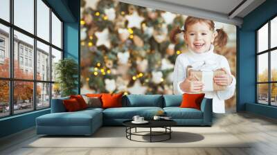 happy child girl with Christmas present Wall mural