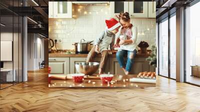 happy children boy and girl bake christmas cookies Wall mural