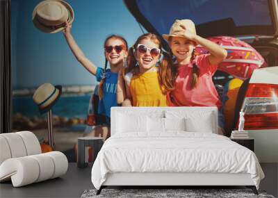 happy children girls friends sisters on the car ride to summer trip. Wall mural