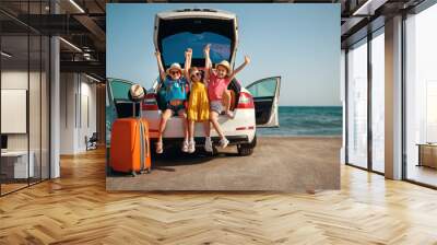 happy children girls friends sisters on the car ride to summer trip. Wall mural