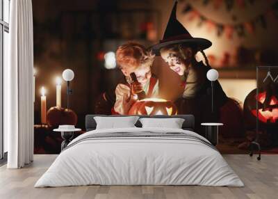 happy children in costumes of witch and vampire in a dark house in halloween. Wall mural