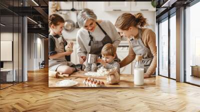 happy family a grandmother with her daughter and grandchildren cooks in kitchen, kneads dough, bakes cookies. Wall mural