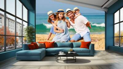 happy family father, mother and children on beach at sea Wall mural