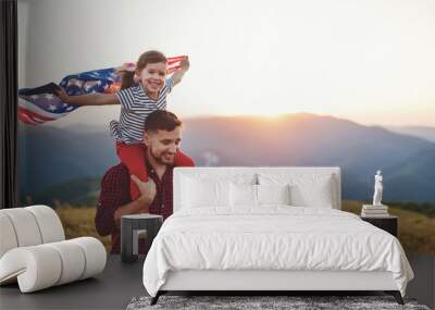 happy family father and child  with flag of united states enjoying  sunset on nature. Wall mural