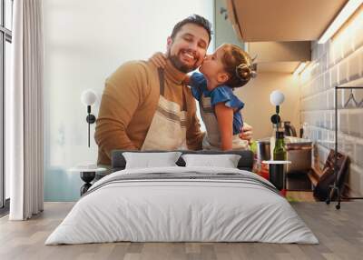 happy family father with child daughter preparing vegetable salad . Wall mural