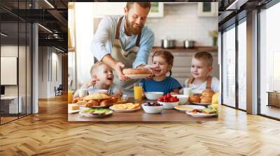 happy family father with children feeds his sons and daughter in kitchen with Breakfast Wall mural