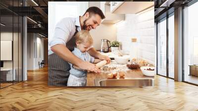 happy family in kitchen. father and child baking cookies  . Wall mural