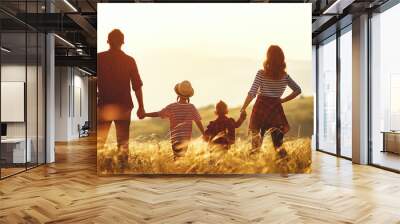 Happy family: mother, father, children son and daughter on sunset. Wall mural