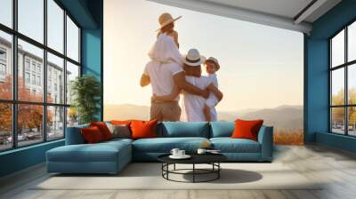 Happy family: mother, father, children son and daughter on sunset Wall mural