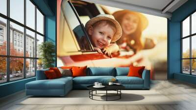 happy family mother and child boy goes to summer travel trip in car Wall mural