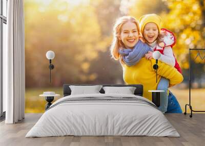 happy family mother and child daughter on   autumn walk Wall mural