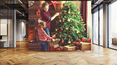 happy family mother and child girl decorated Christmas tree Wall mural