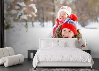 happy family mother and child playing on winter walk Wall mural