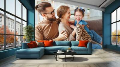 happy family mother father and child daughter laughing   at home  . Wall mural