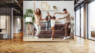 happy family mother father and children dancing at home Wall mural