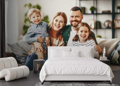 happy family mother father and kids at home on couch . Wall mural