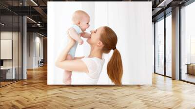 happy family mother playing  with baby Wall mural