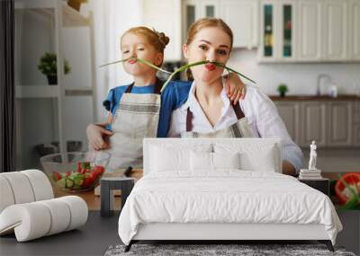 happy family mother with child girl preparing vegetable salad Wall mural