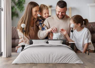 Happy family saving money together. Wall mural