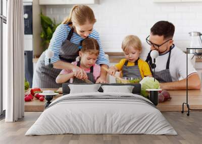 happy family with children preparing vegetable salad Wall mural