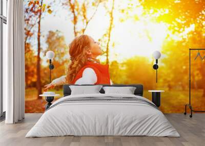 happy girl enjoying life and freedom in the autumn on nature Wall mural