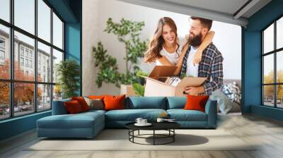 happy young married couple moves to new apartment Wall mural