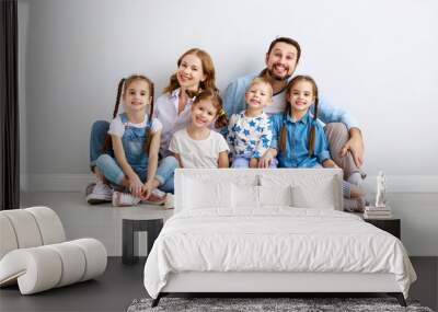 large family mother father and children sons and daughters on white background. Wall mural