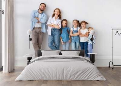 large family mother father and children sons and daughters on white background Wall mural