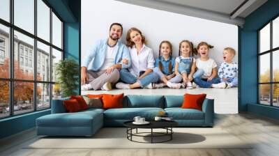 large family mother father and children sons and daughters on white background Wall mural