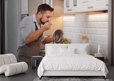 man cooks baking   cookies at home Wall mural