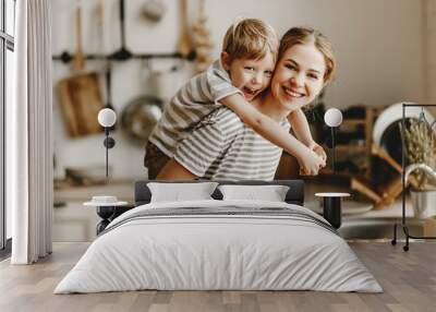 preparation of family breakfast. mother and child son cut bread  and eat cookies with milk in morning. Wall mural