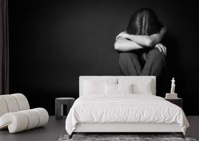 woman in depression and despair crying on black dark Wall mural