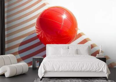 A bright red beach ball awaits fun in the sun on a comfortable lounger. Perfect for a summer vacation. Wall mural