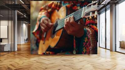 A vibrant close-up of a musician wearing a colorful sombrero and holding a guitar, exuding a lively mariachi spirit. The warm lighting and focus on the instrument convey a sense of passion and energy. Wall mural