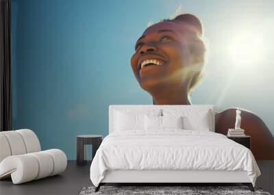 Fitness, black woman and happy athlete smile after running, exercise and marathon training workout. Blue sky, summer sports and run of a African runner breathing with happiness from sport outdoor Wall mural