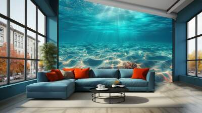 Seabed sand with blue tropical ocean above, empty underwater background with the summer sun shining brightly, creating ripples in the calm sea water Wall mural