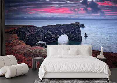 Majestic large arch of lava on the coast in Atlantic Ocean during sunset. Amazing Icelandic scenery. one most Popular Travel destinations in Iceland. Sudurland, cape Dyrholaey, Iceland, Vik, Europe Wall mural