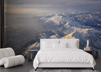 Aerial view from airplane of the Wasatch Front Rocky Mountain Range with snow capped peaks in winter including urban cities of Provo, Farmington Bountiful, Orem and Salt Lake City. Utah. United States Wall mural