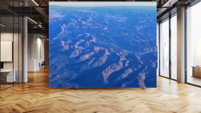 Aerial view of topographical Rocky Mountain landscapes on flight over Colorado and Utah during autumn. Grand sweeping views of rivers, mountain and landscape patterns. Top view, Rockies and Wasatch Wall mural