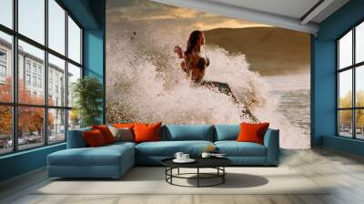 Caucasian redhead woman with mermaid tail perches on rock with pounding waves around her Wall mural