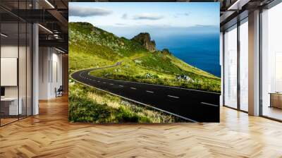 Azores landscape: Endless curvy winding road through the hills of Flores island, the Azores, Portugal. Wall mural