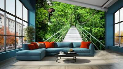 Howler at the hanging bridge at the tropical rainforest at Sarapiqui, Costa Rica. Bridge crossing Sarapiqui river. Wall mural