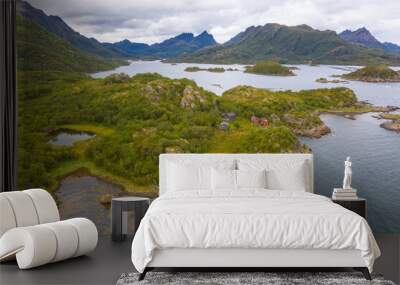 lush green islands scattered along the coast of the lofoten islands, norway. k Wall mural