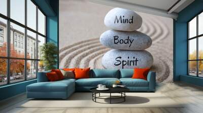 Mind, body and soul text on zen stones with sand background Wall mural