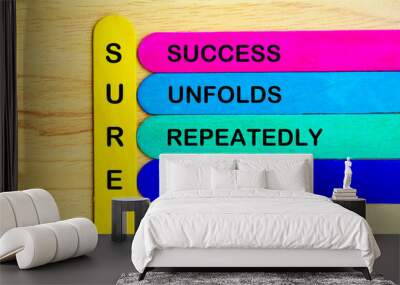 Sure represent Success Unfolds Repeatedly everytime text on multicolored sticks. Growth concept Wall mural